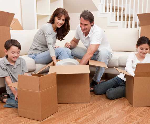 Family packing up households for the moving day | CB Moving and Storage