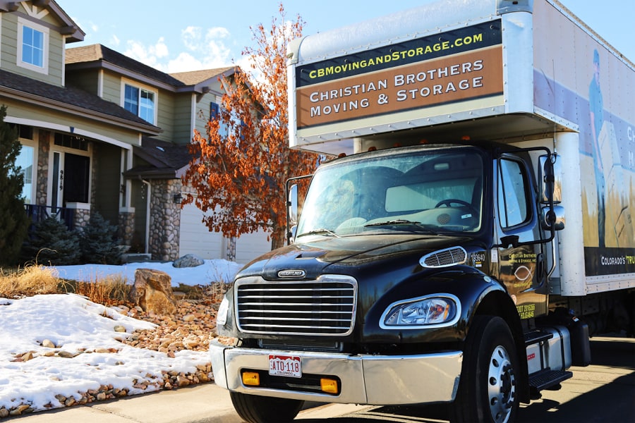 Moving truck outside residential home | CB Moving and Storage